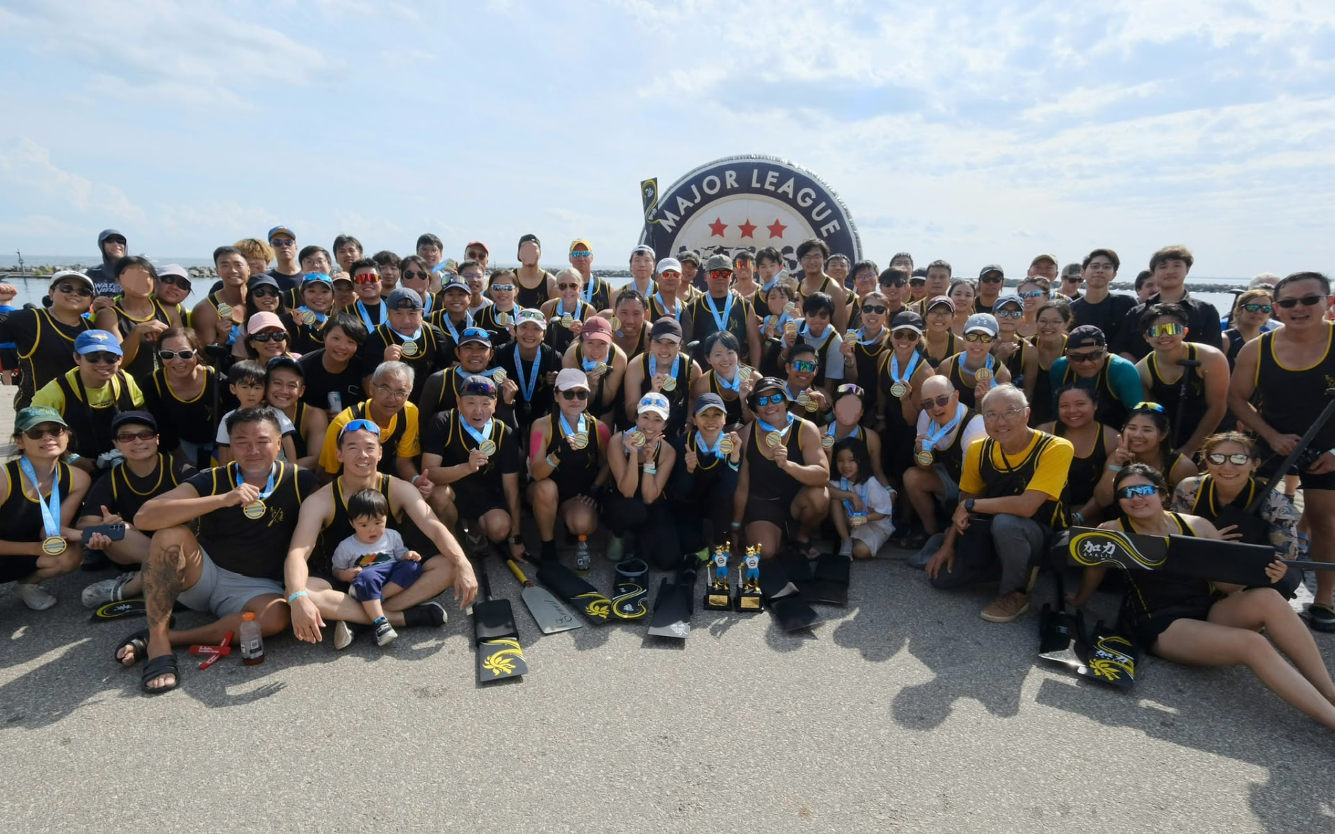 TOHK team celebrating with medals and trophies